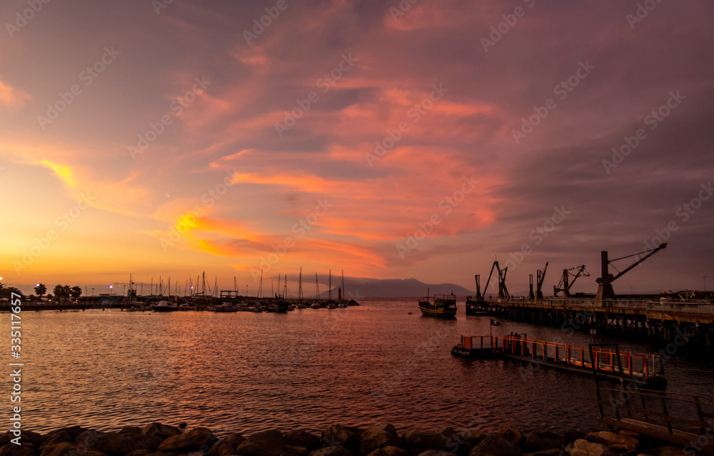 Fototapeta premium Antofagasta, Chile; December 26, 2018: beautiful sunset colors and colored clouds.