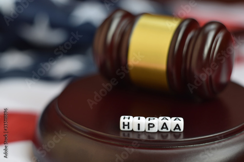 Justice mallet and HIPAA acronym. Health insurance portability and accountability act photo