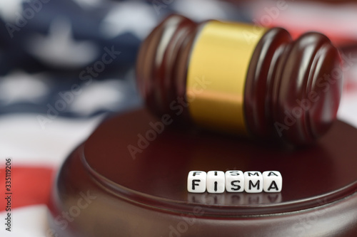 Justice mallet and FISMA acronym. Federal information security management act photo