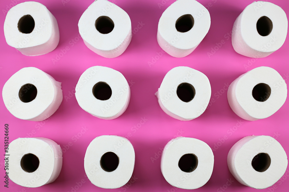 Toilet paper rolls with a pink background Toilet paper rolls with a pink background