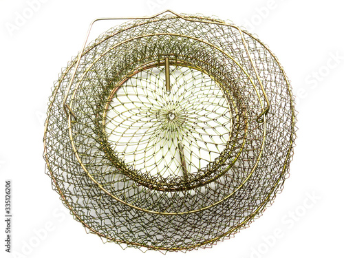 Fishing cage isolated on a white background. Steel wire fishing.