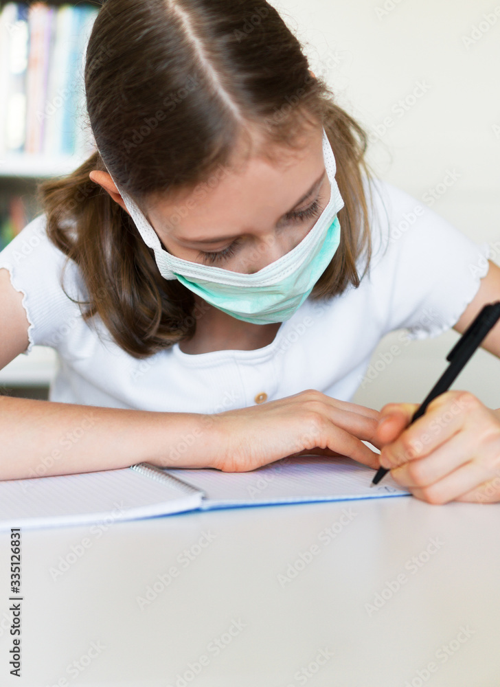 Little girl doing school homework during quarantine. Little girl doing school homework during quarantine.