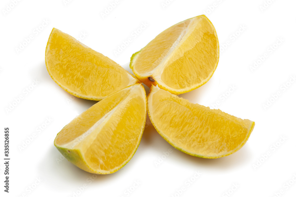 yellow grapefruit cut into four parts on a white background. Isolate yellow grapefruit cut into four parts on a white background. Isolate