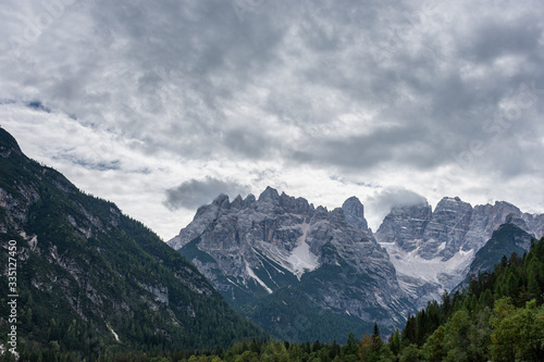 Italian Dolomites in front of the Cadore lake on a cloudy autumn day