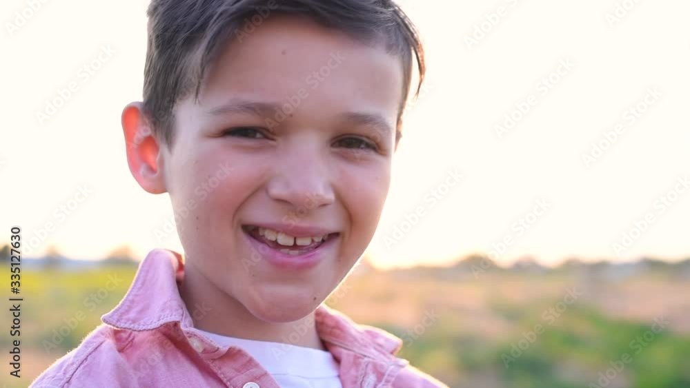 Portrait handsome boy in siiting in field Portrait handsome boy in siiting in field