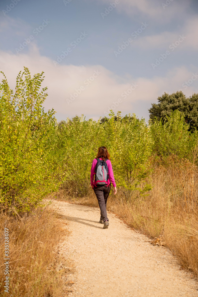 trekker in rural landscape spain