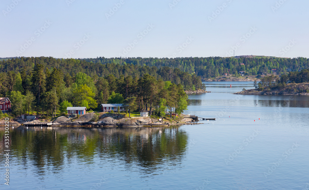 Sweden, small houses on an island in  Baltic Sea