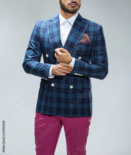 Atelier to repair clothes, Stylish look, Fashion look, Men look, Wedding style, Fashion concept, Brand clothing, Classic costume,Suit on black background. Store display. Classic style. Grey background