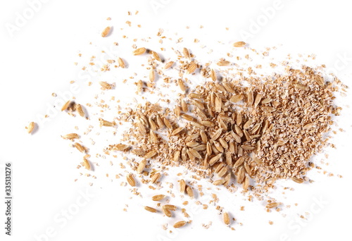 Spelt grain and bran isolated on white background, top view 