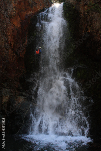 Rappeling down a waterfall, Canyoneering