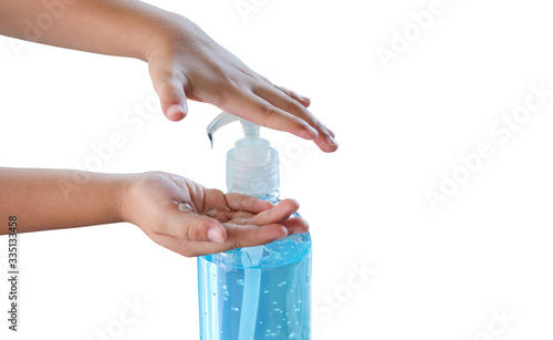 Kid pouring alcohol based sanitizer gel himself. Isolated on white background.