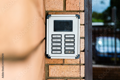 intercom buzzer at apartment entrance photo