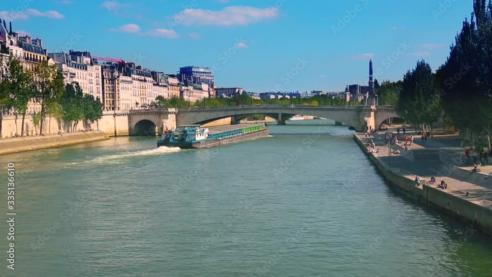 Cargo boat with freight on the Seine in Paris, France Cargo boat with freight on the Seine in Paris, France