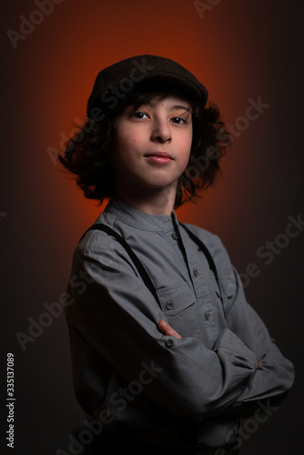 Portrait of a boy in a cap.