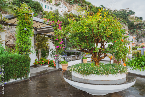 Amazing view of the colorful garden on terrace of hotel, Amalfi coast