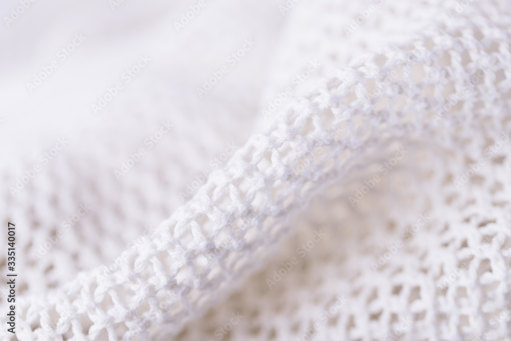 White fabric mesh textile background, knitting background texture White fabric mesh textile background, knitting background texture