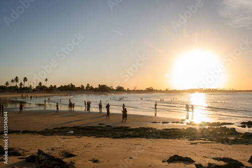 Silhouette of people on the sunset beach