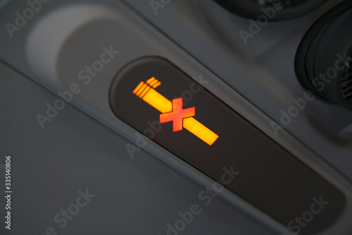 No smoking yellow plane sign while flying