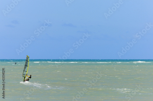 A lonely windsurfer on the water