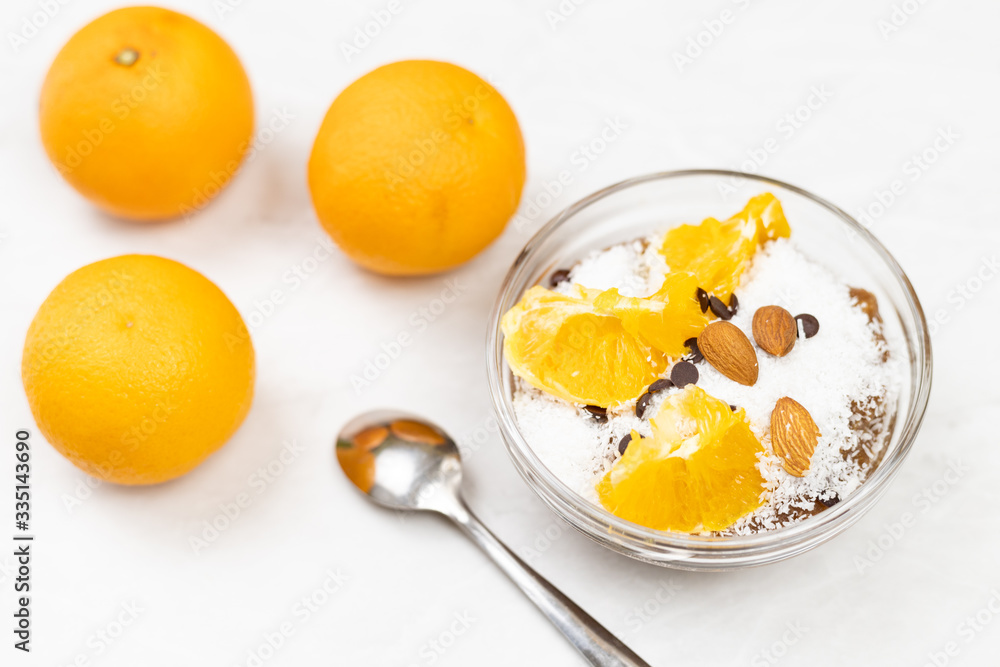 Ice cream with coconut and sliced orange on the top Ice cream with coconut and sliced orange on the top