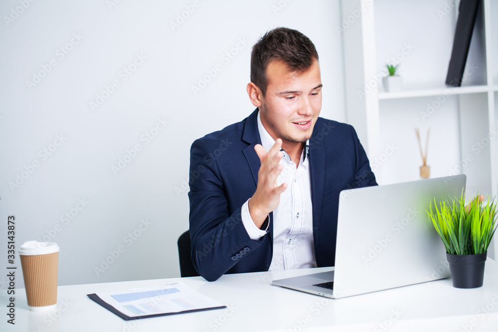 Solid businessman in a jacket works in office of company. Solid businessman in a jacket works in office of company.