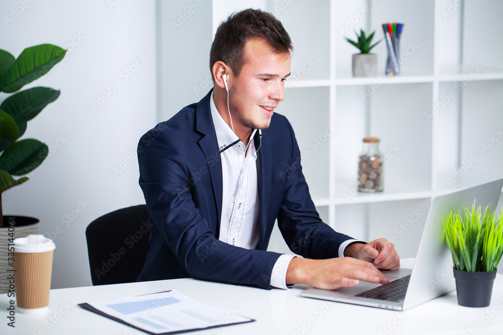 Solid businessman in a jacket works in office of company. Solid businessman in a jacket works in office of company.
