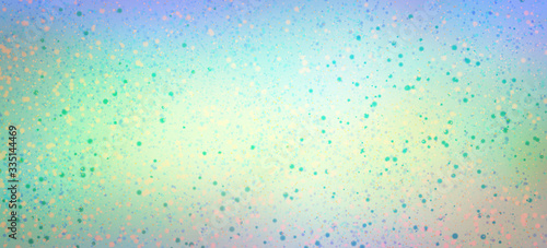 Cute pastel Easter background with speckled egg pattern paint drips or spatter in light blue pink purple green and yellow spring colors photo