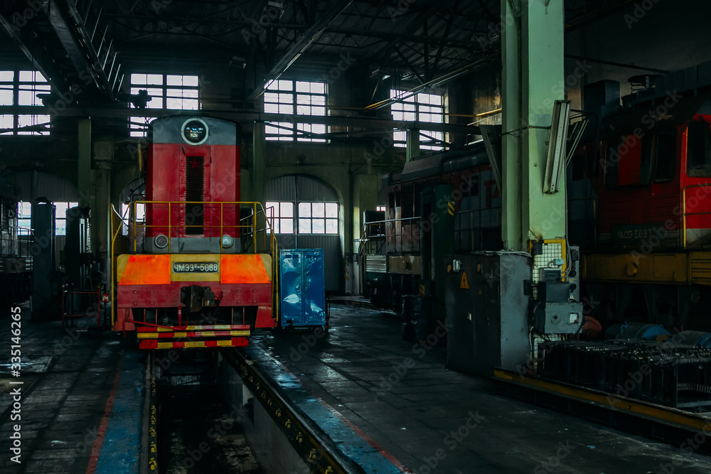 Old diesel locomotive at train depot