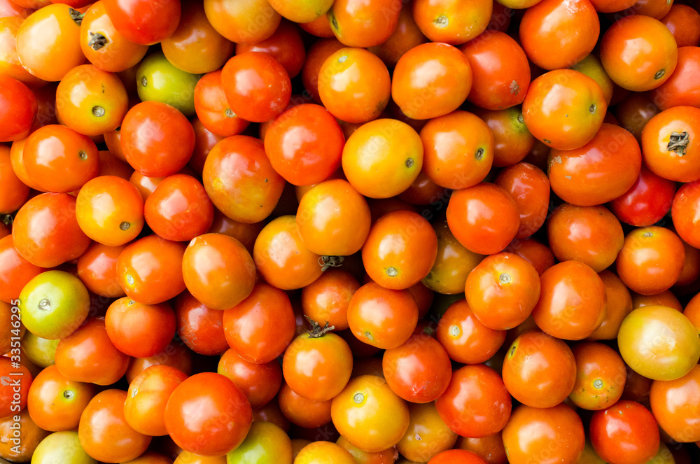 Flat lay view of small tomatoes