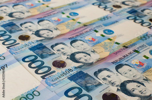 Flat lay view of 1000 Philippine peso cash