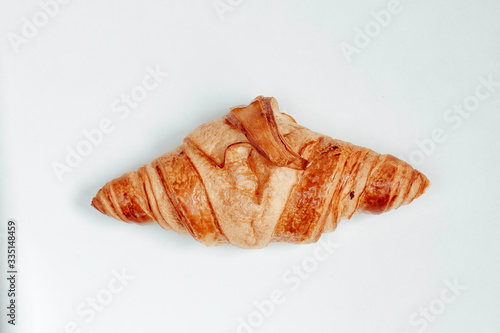 Homemade baked croissants on white background