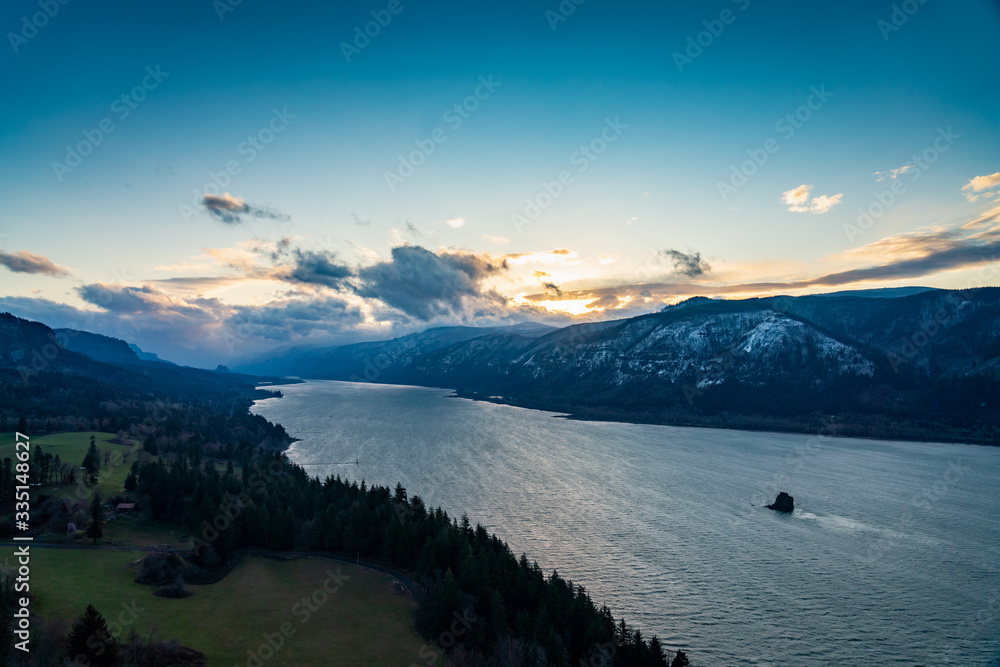 sunrise over the mountains with lake in the foreground sunrise over the mountains with lake in the foreground