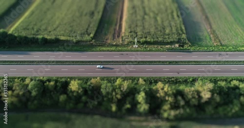 Highway between tiltshift fields photo