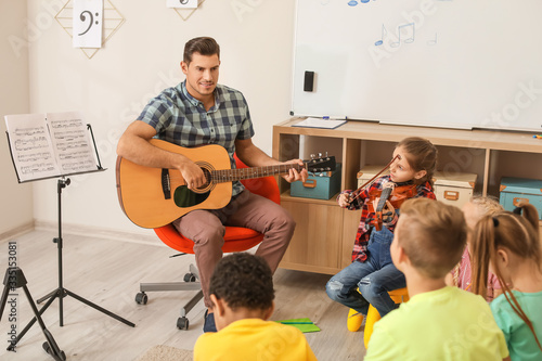 Teacher giving music lesson...