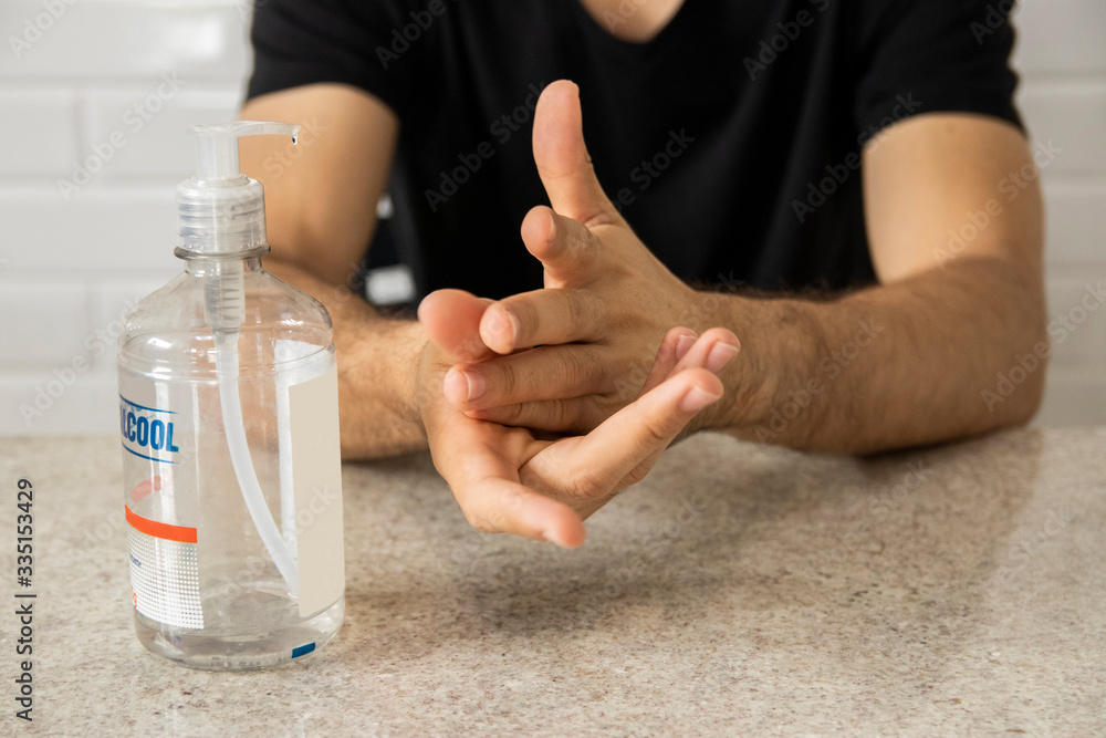 Coronavirus prevention. Man using alcohol gel for hand hygiene. Hygiene concept. Novel coronavirus. (2019-nCoV). Covid-19. Coronavirus prevention. Man using alcohol gel for hand hygiene. Hygiene concept. Novel coronavirus. (2019-nCoV). Covid-19.