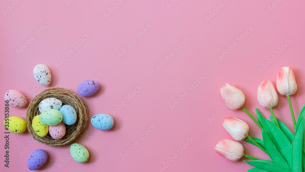 Happy easter, Top view of Easter eggs and tulip flower on pink color backgroud Happy easter, Top view of Easter eggs and tulip flower on pink color backgroud