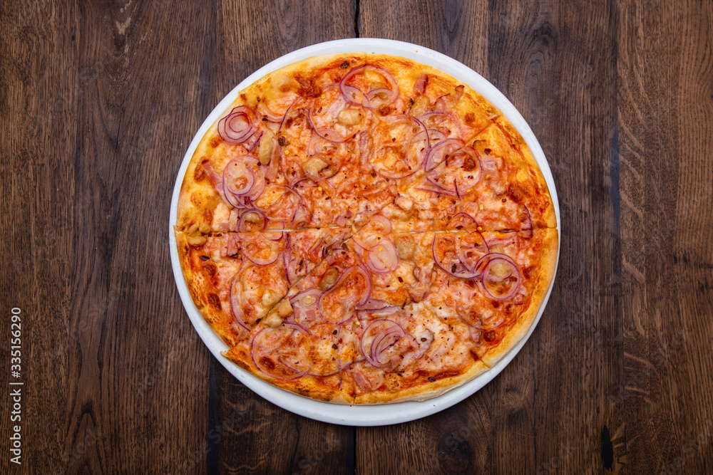Classic Italian pizza on a wooden table