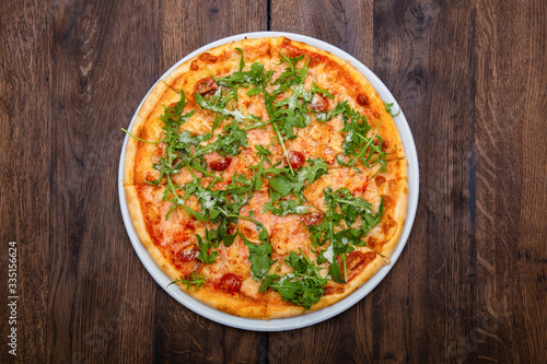 Classic Italian pizza on a wooden table