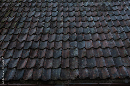 Dark grey aged roof tiles texture