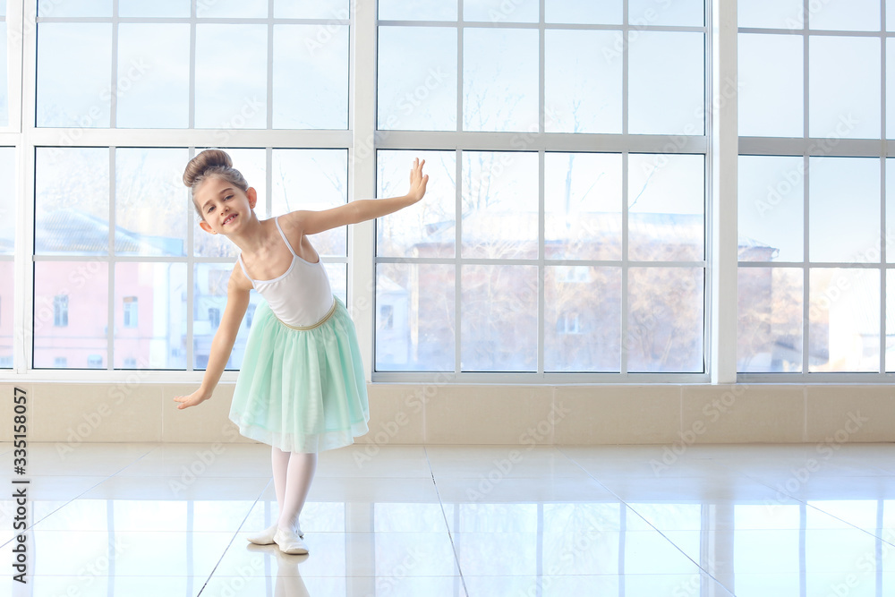 Cute little ballerina in dance studio Cute little ballerina in dance studio