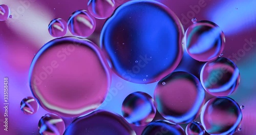 Movement oxygen bubbles in a liquid. Beautiful structure of water in macro a natural background	