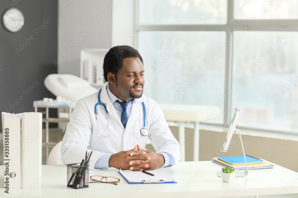 Male African-American doctor in clinic Male African-American doctor in clinic