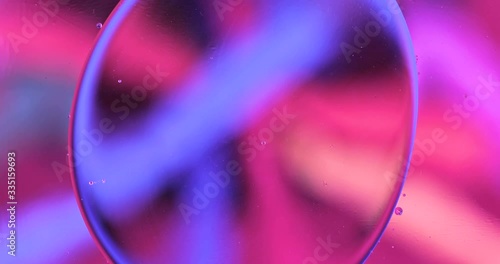 Movement oxygen bubbles in a liquid. Beautiful structure of water in macro a natural background	