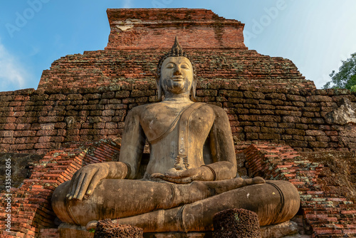 Old big Buddha statue in archaeological site Sukhothai, Thailand photo