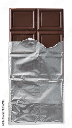 Dark chocolate bar in silver foil packaging top view isolated
