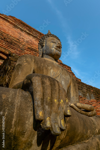 Old big Buddha statue in archaeological site Sukhothai, Thailand photo