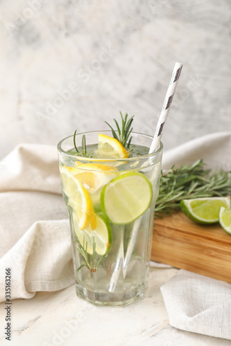 Glass of fresh lime lemonade on table