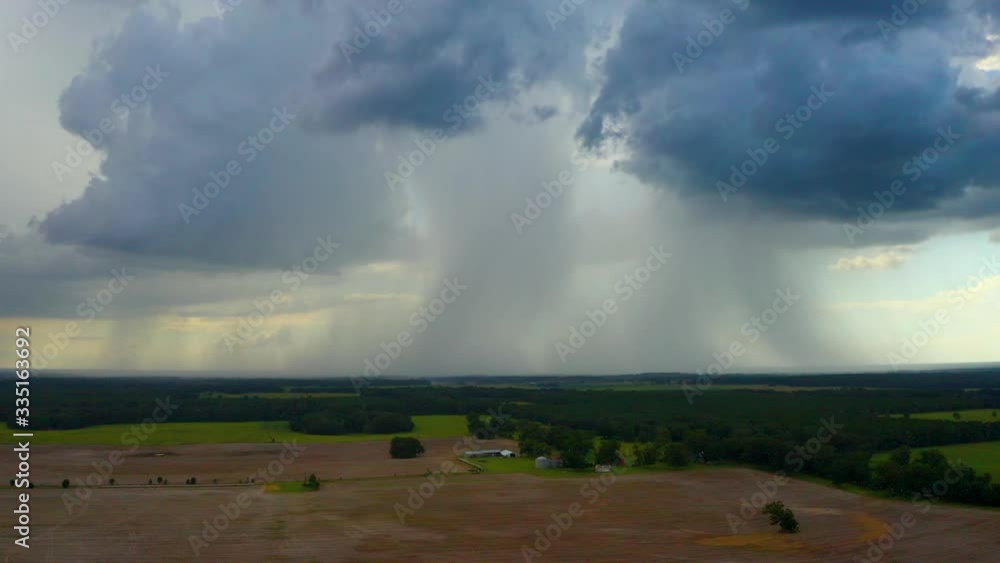 Rain clouds drop a lot of precipitation over the Florida landscape as seen from a drone Rain clouds drop a lot of precipitation over the Florida landscape as seen from a drone