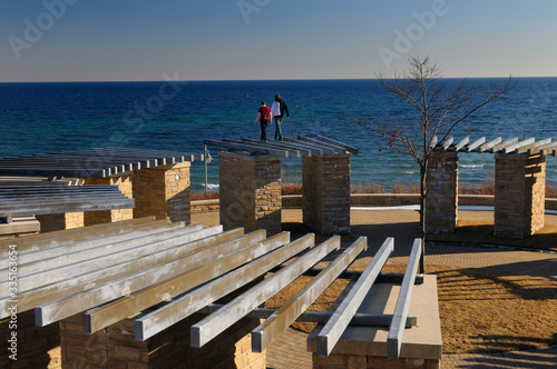 Parkour traceurs walking on top of stonehenge structure at Ajax waterfront at the old water plant site