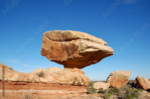 Massive balanced boulder in canyon country in the Bears Ears wilderness of Southern Utah.